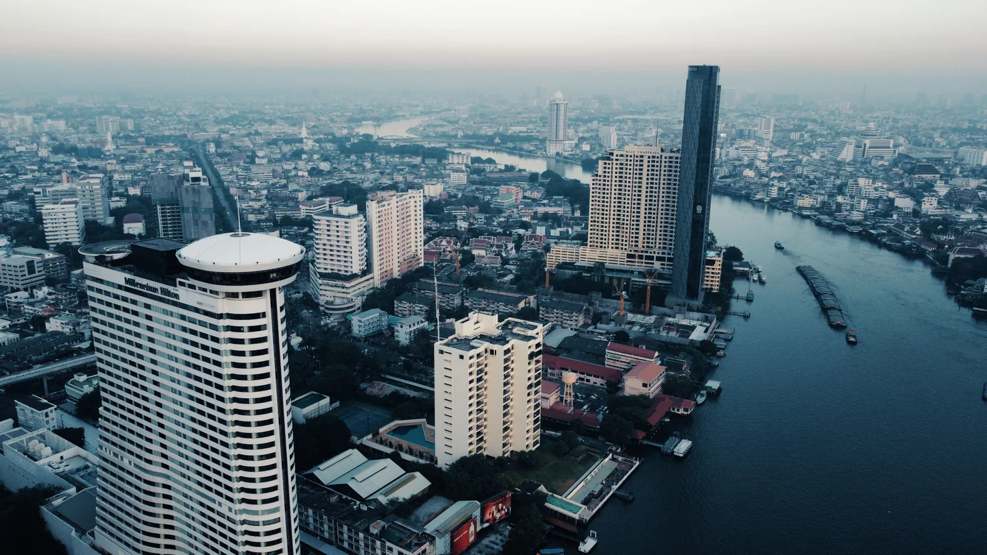 Aerial view of Bangkok buildings and the Chao Phraya River.