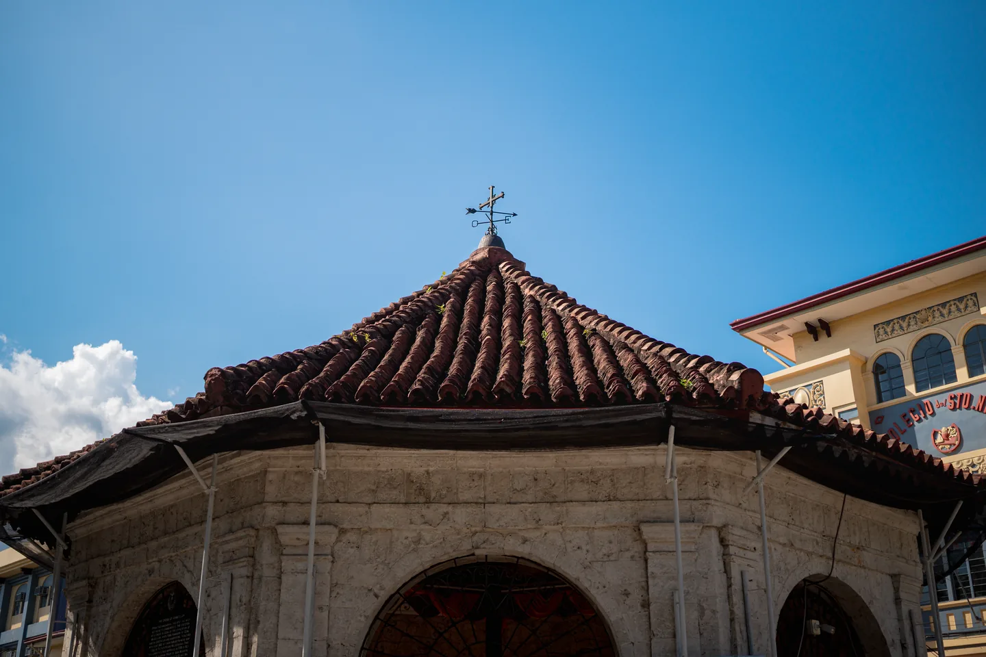 Magellan’s Cross Pavilion beside Cebu City Hall beneath a blue sky