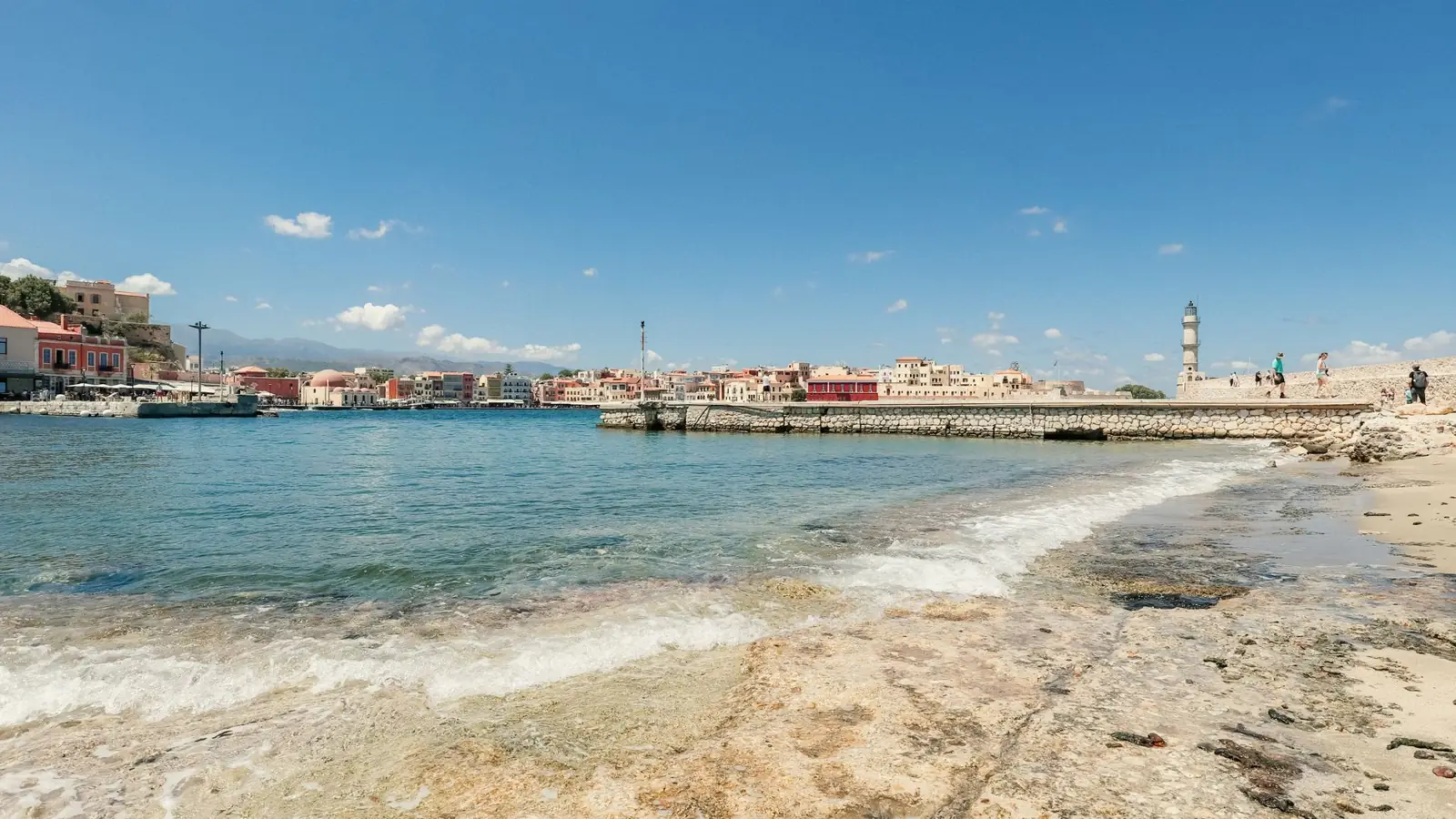 Chania’s harbour breakwater and lighthouse seen across the water