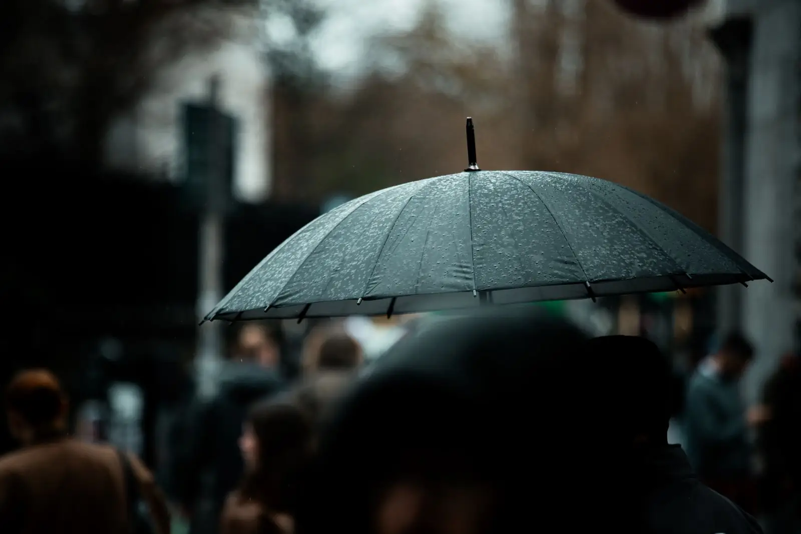 People with umbrellas on a rainy Dublin street