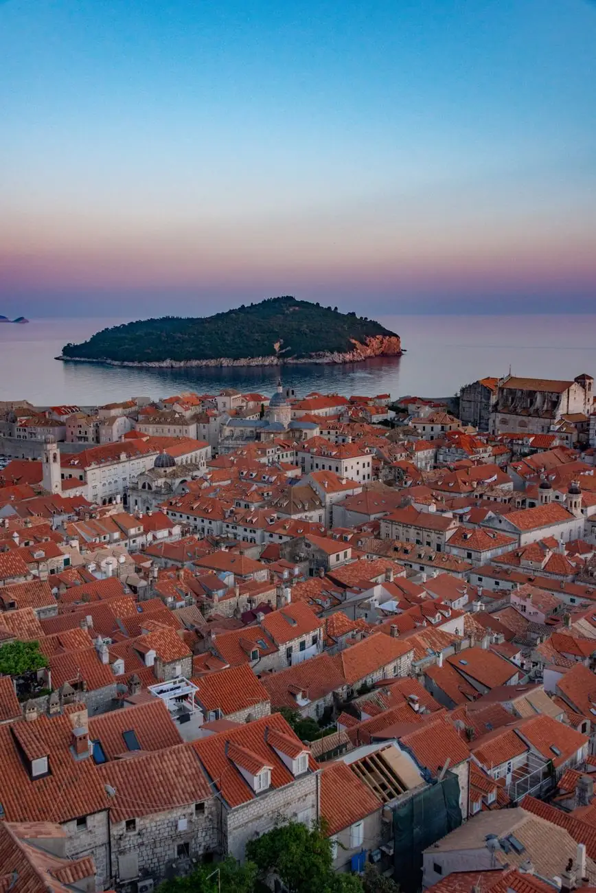 Dubrovnik’s terracotta roofs with Lokrum island across the sea