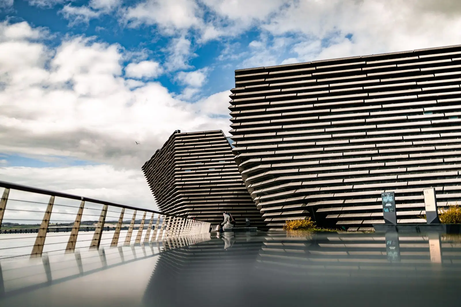 The angular facade of V&A Dundee beside the River Tay