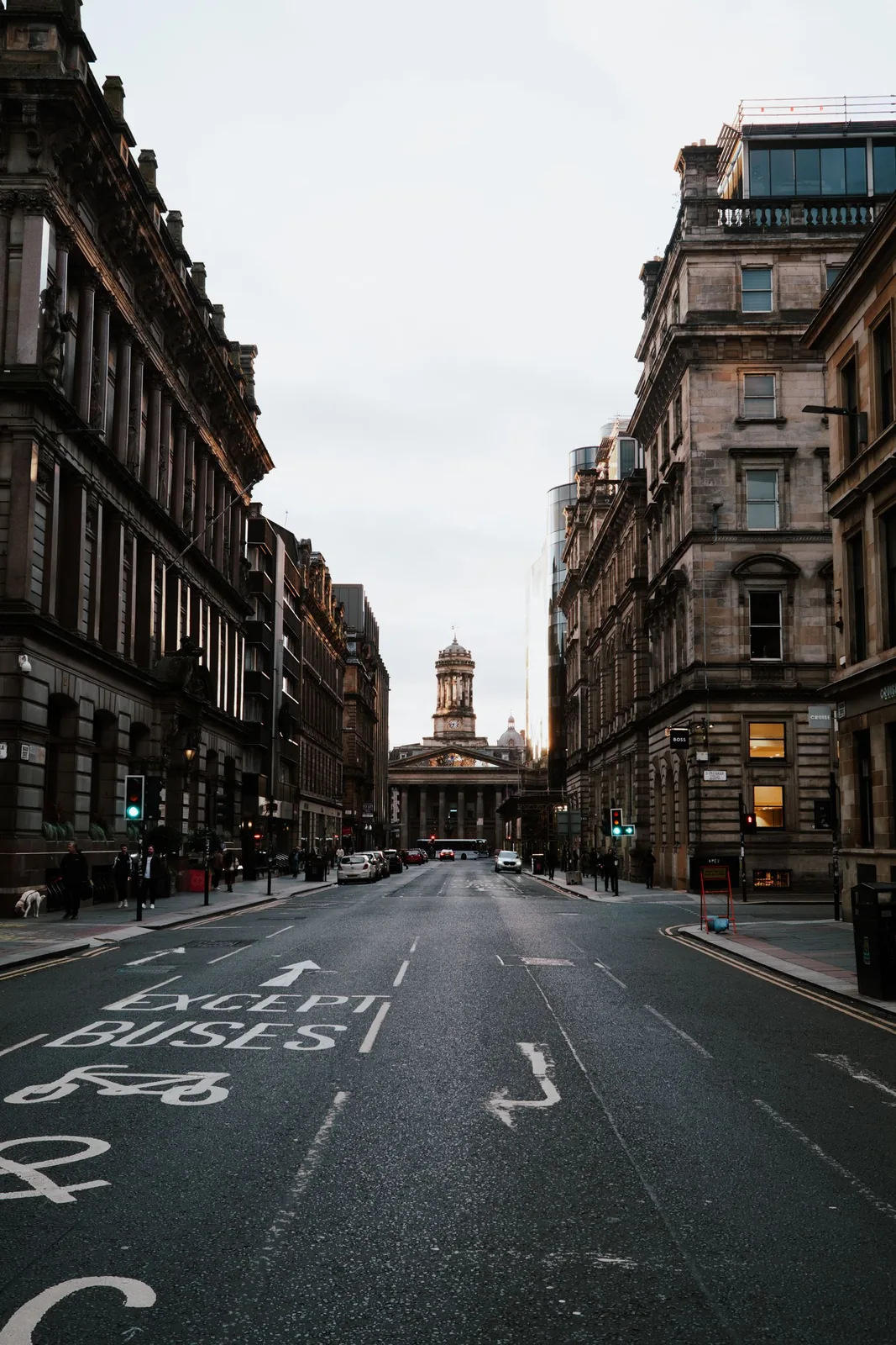 Historic buildings and traffic on George Street in Glasgow