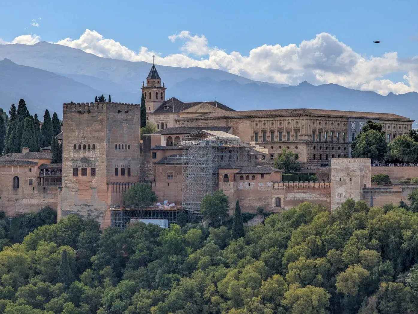 A panoramic view of Granada's Alhambra with mountains beyond