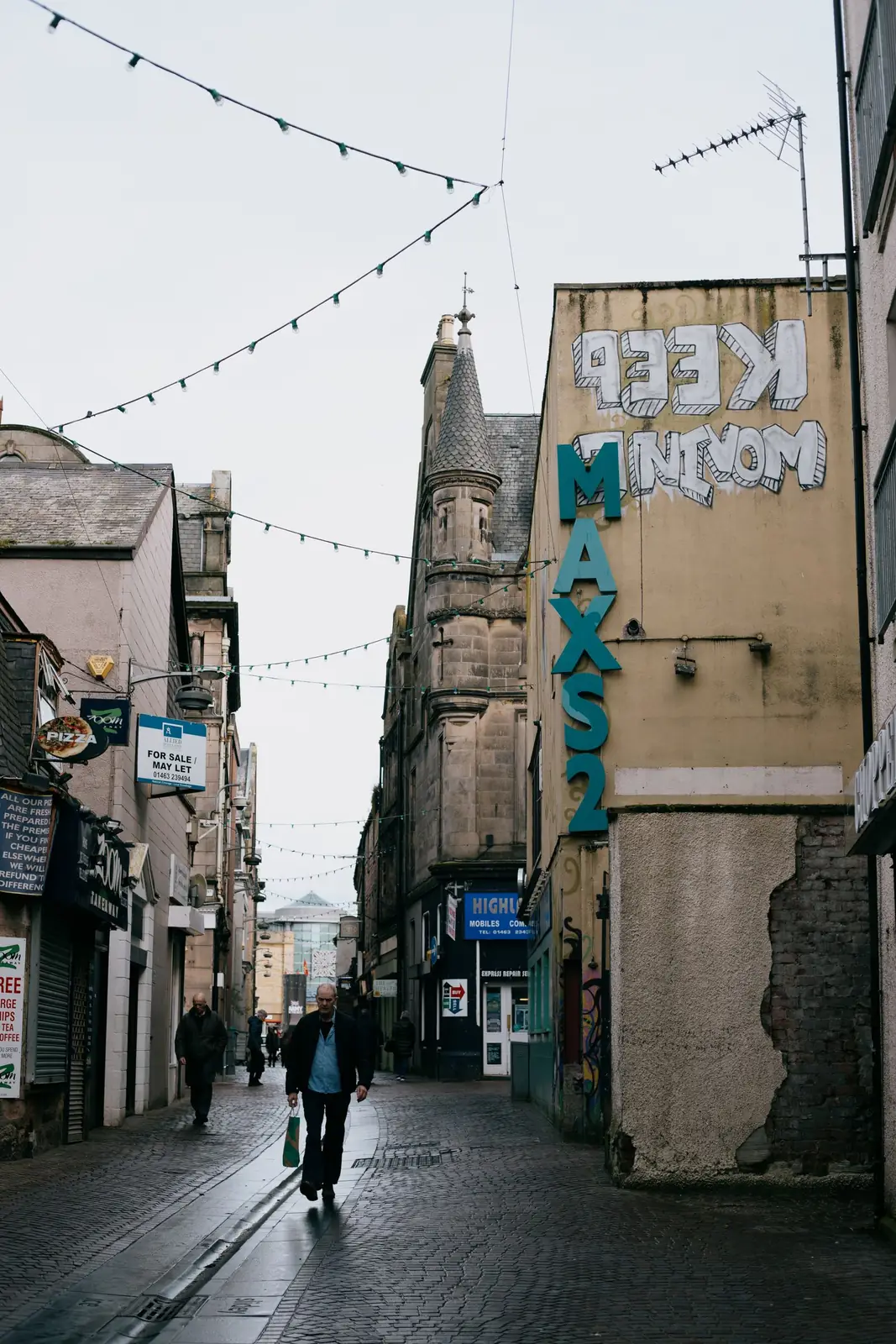 Pedestrians in Inverness’s old city streets