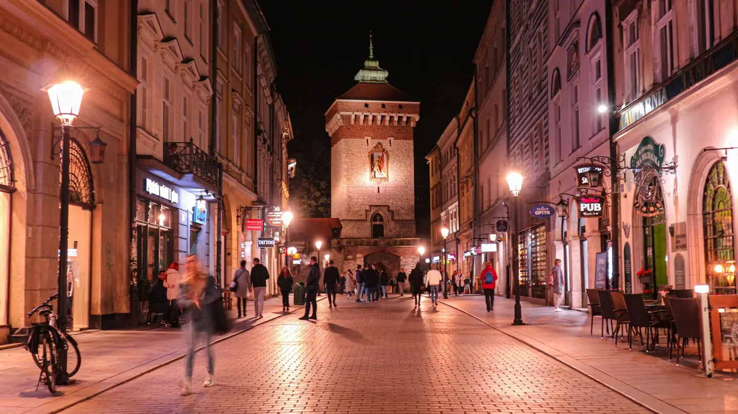 St Florian’s Gate at the end of Floriańska Street in Kraków at night