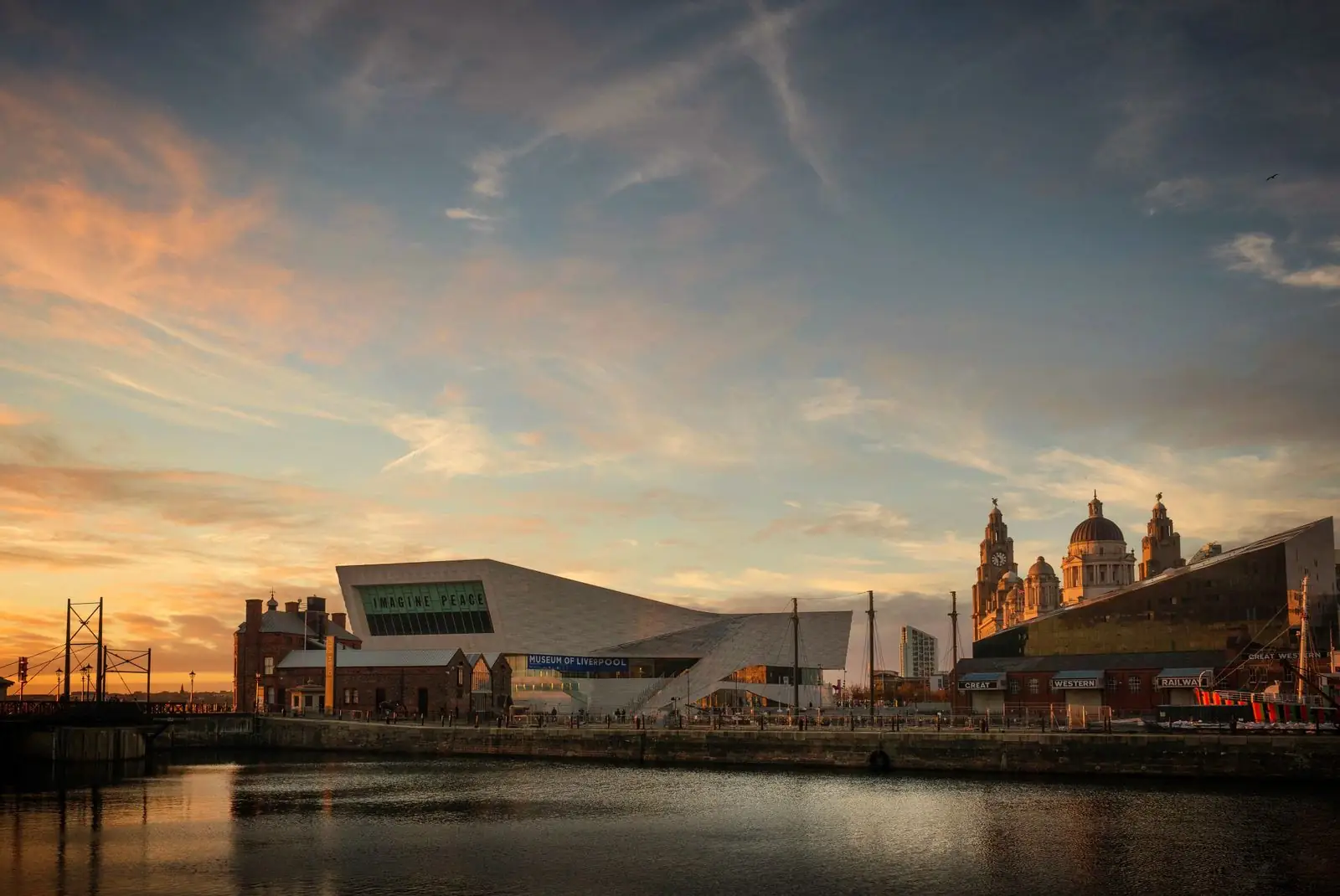 Museum of Liverpool and the Three Graces along the waterfront at sunset