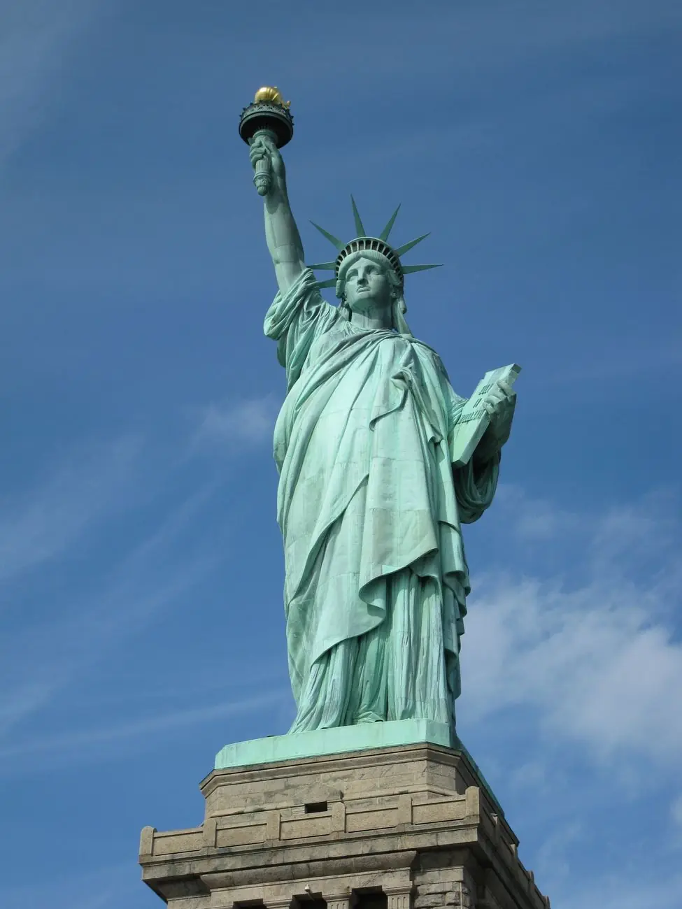 Statue of Liberty’s copper figure on its stone pedestal at Liberty Island