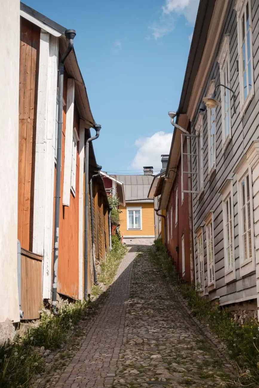 A cobbled lane between wooden houses in Old Porvoo