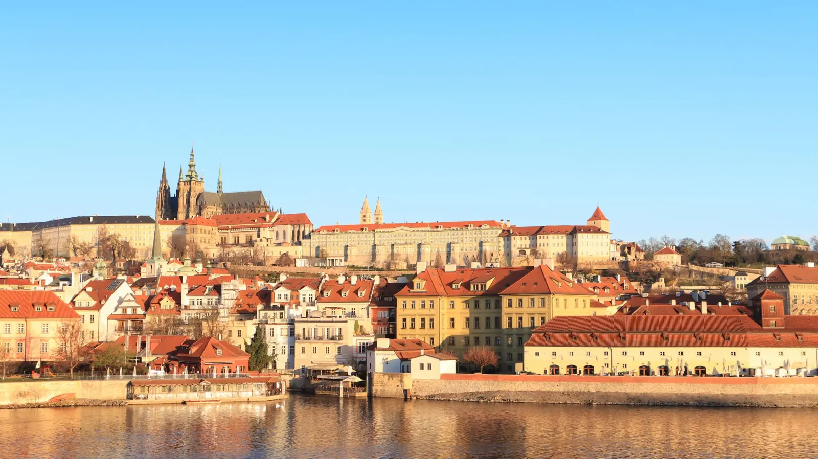 Prague Castle and St Vitus Cathedral above the red roofs of Lesser Town