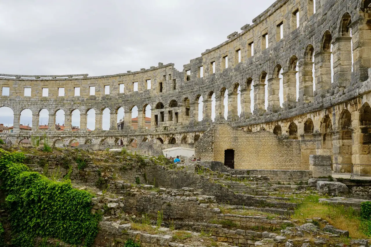 Stone arches inside Pula Arena