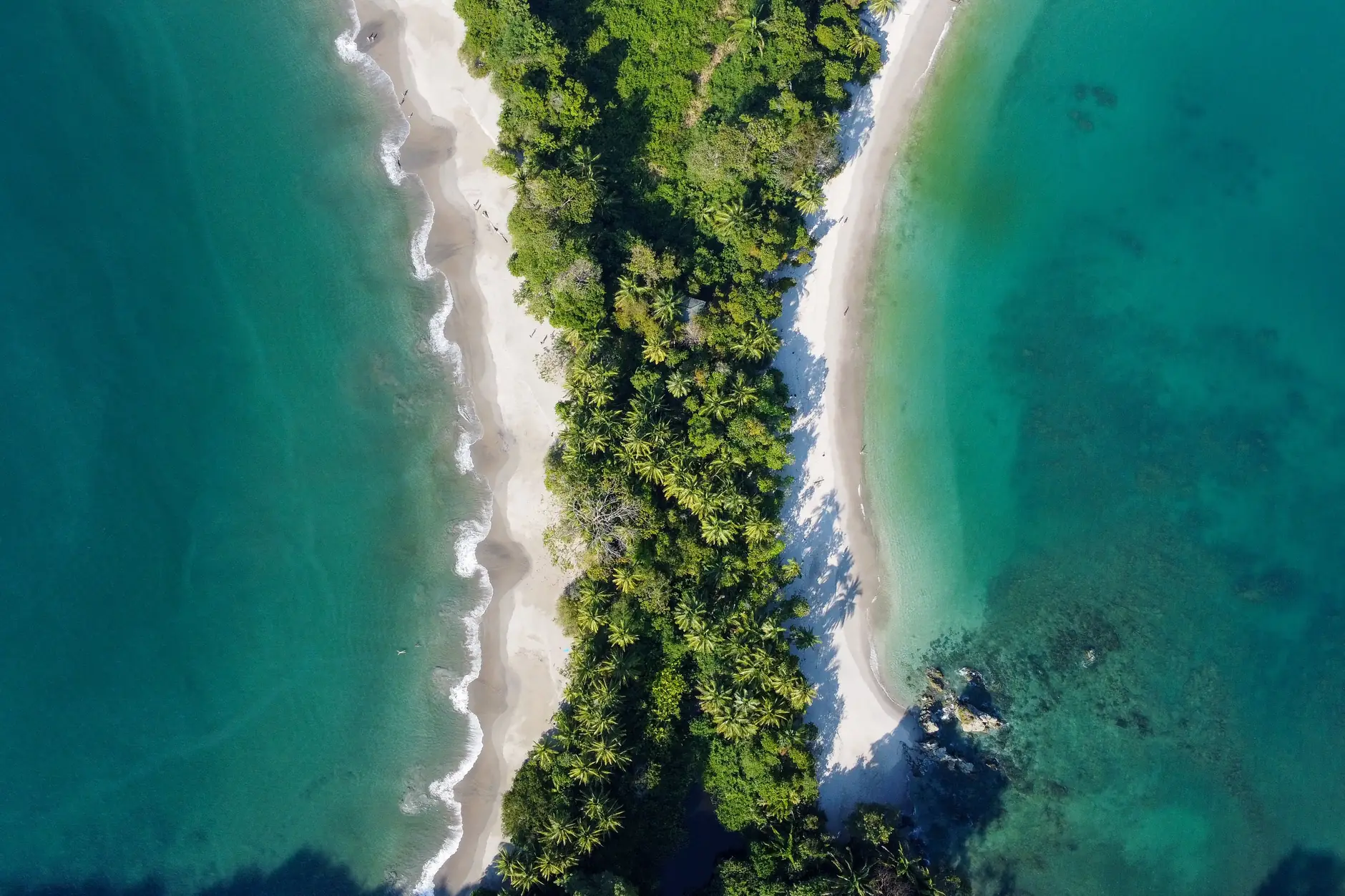 Overhead view of the wooded sand neck between Manuel Antonio beach and Espadilla Sur