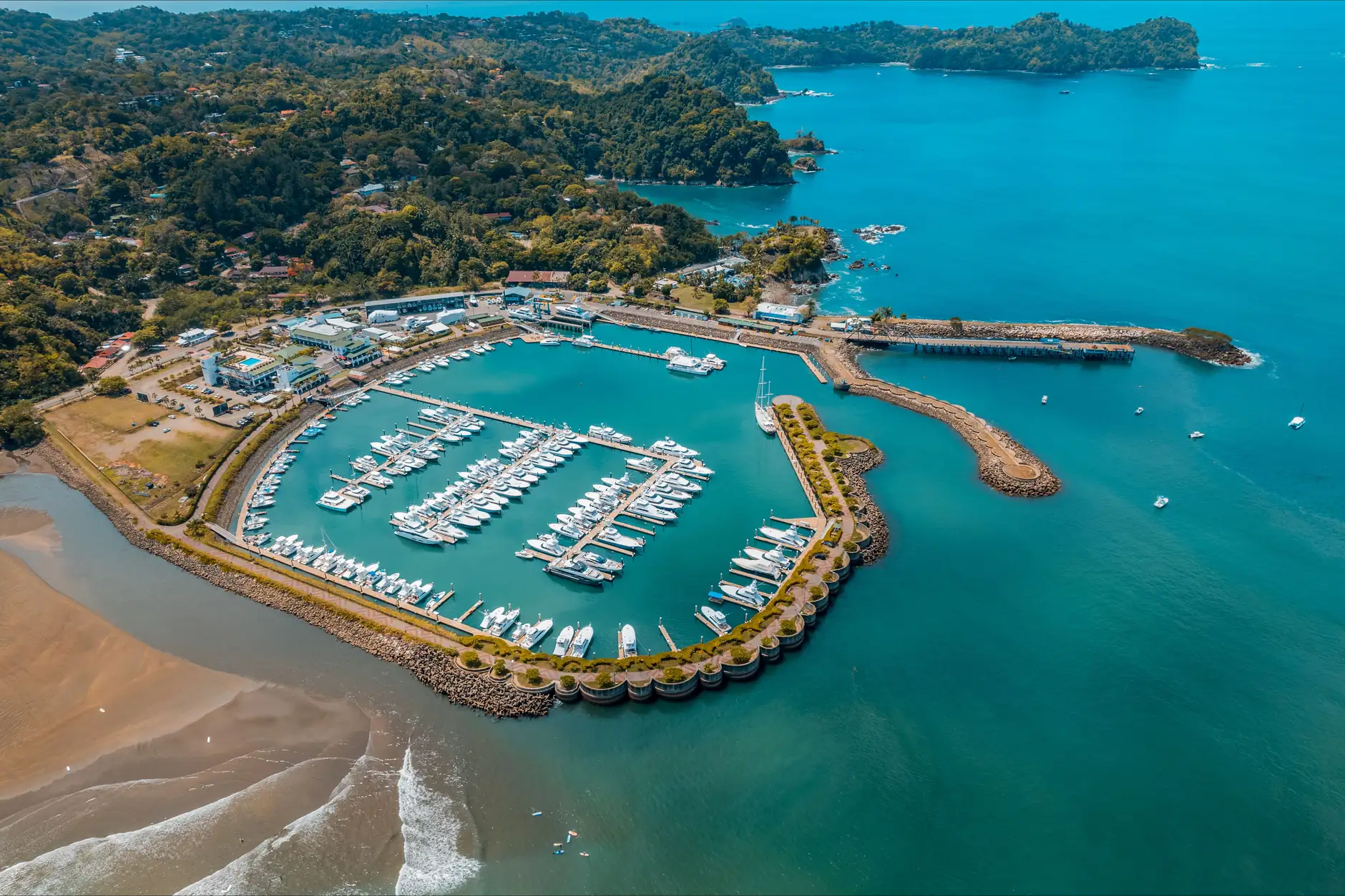 Aerial view of Marina Pez Vela, the Quepos shoreline and wooded coast