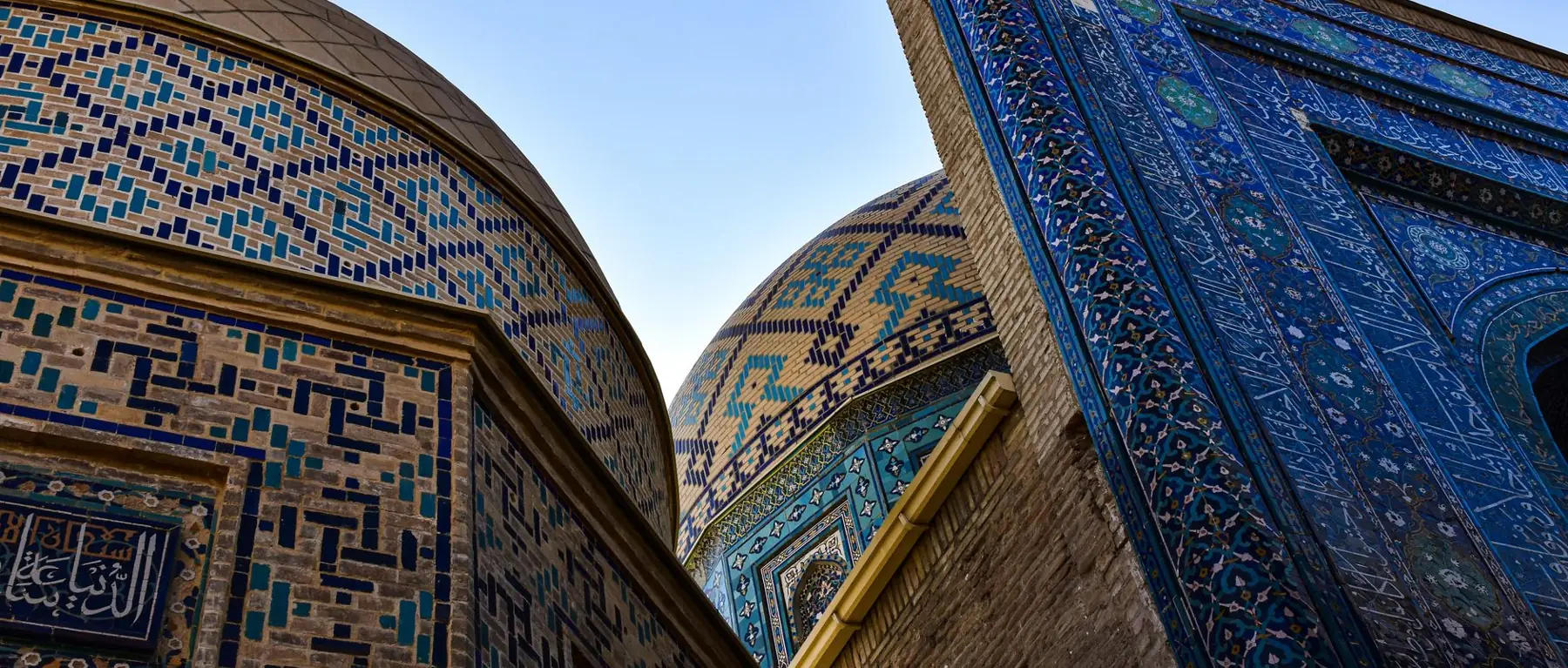 Blue mosaic mausoleums and domes along Shah-i-Zinda in Samarkand