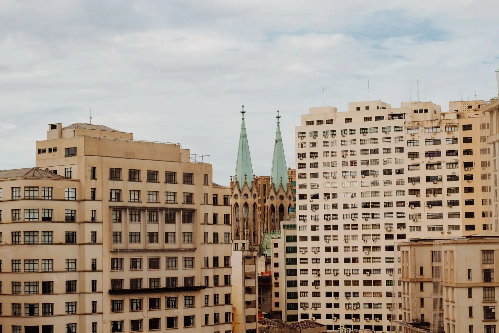 São Paulo Cathedral’s twin green spires between downtown buildings