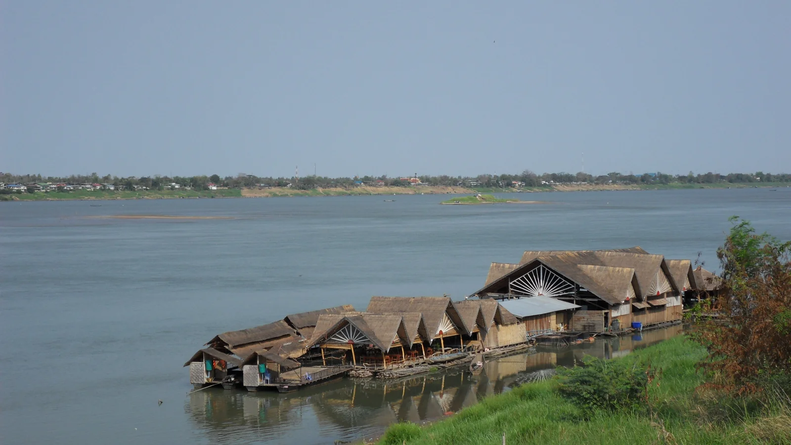 An archival view of floating restaurant structures on the Mekong at Savannakhet; current businesses may differ.