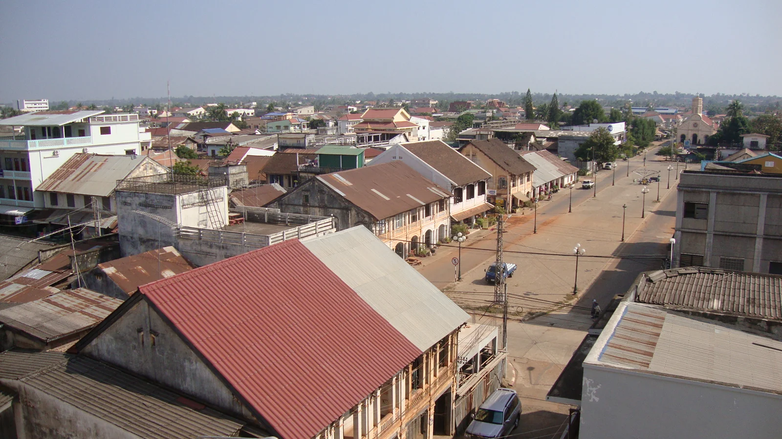 An archival elevated view over the old-town streets and tiled roofs of Savannakhet.