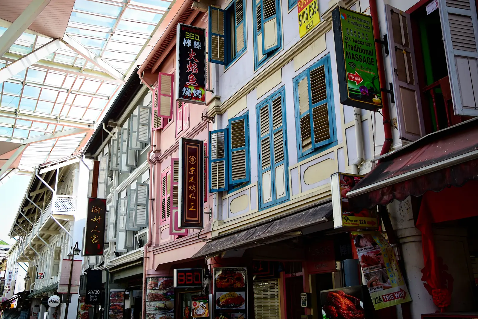 Colorful shophouse windows and shop signs on Smith Street in Singapore’s Chinatown.