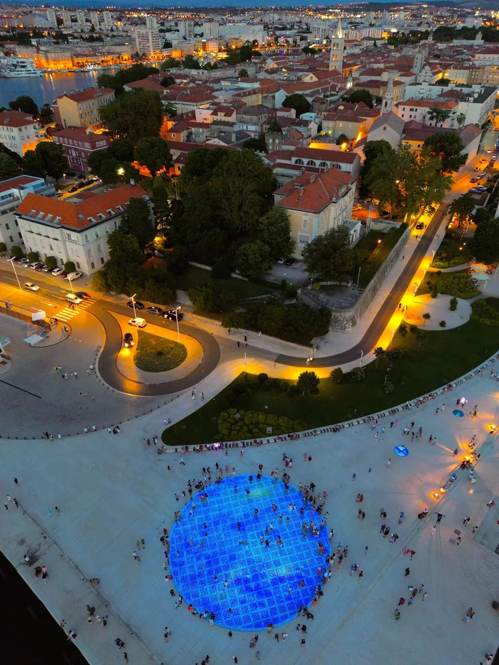 The illuminated Greeting to the Sun on Zadar’s waterfront beside the Sea Organ