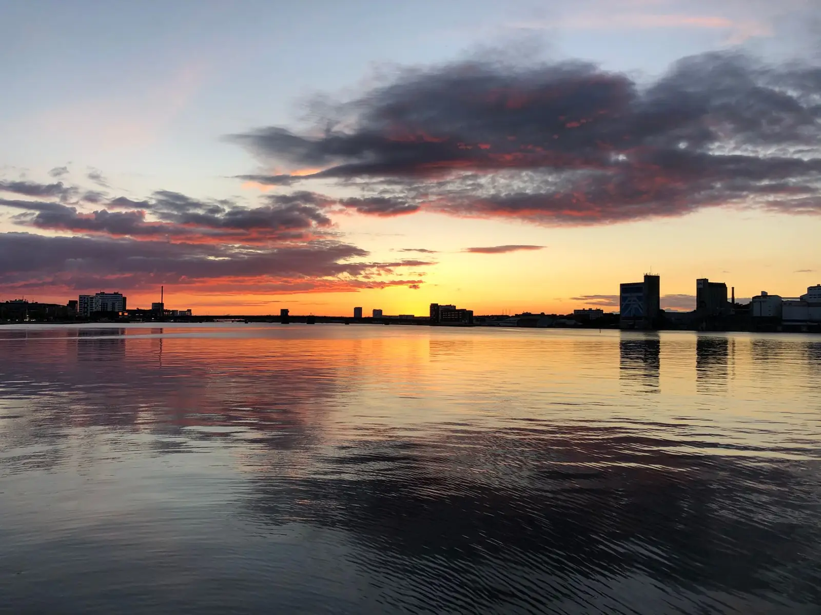 Aalborg skyline beside the Limfjord at sunset