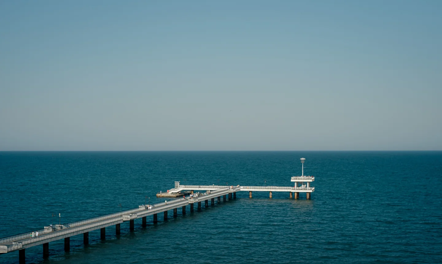 Burgas Pier extending into the Black Sea beneath a clear sky