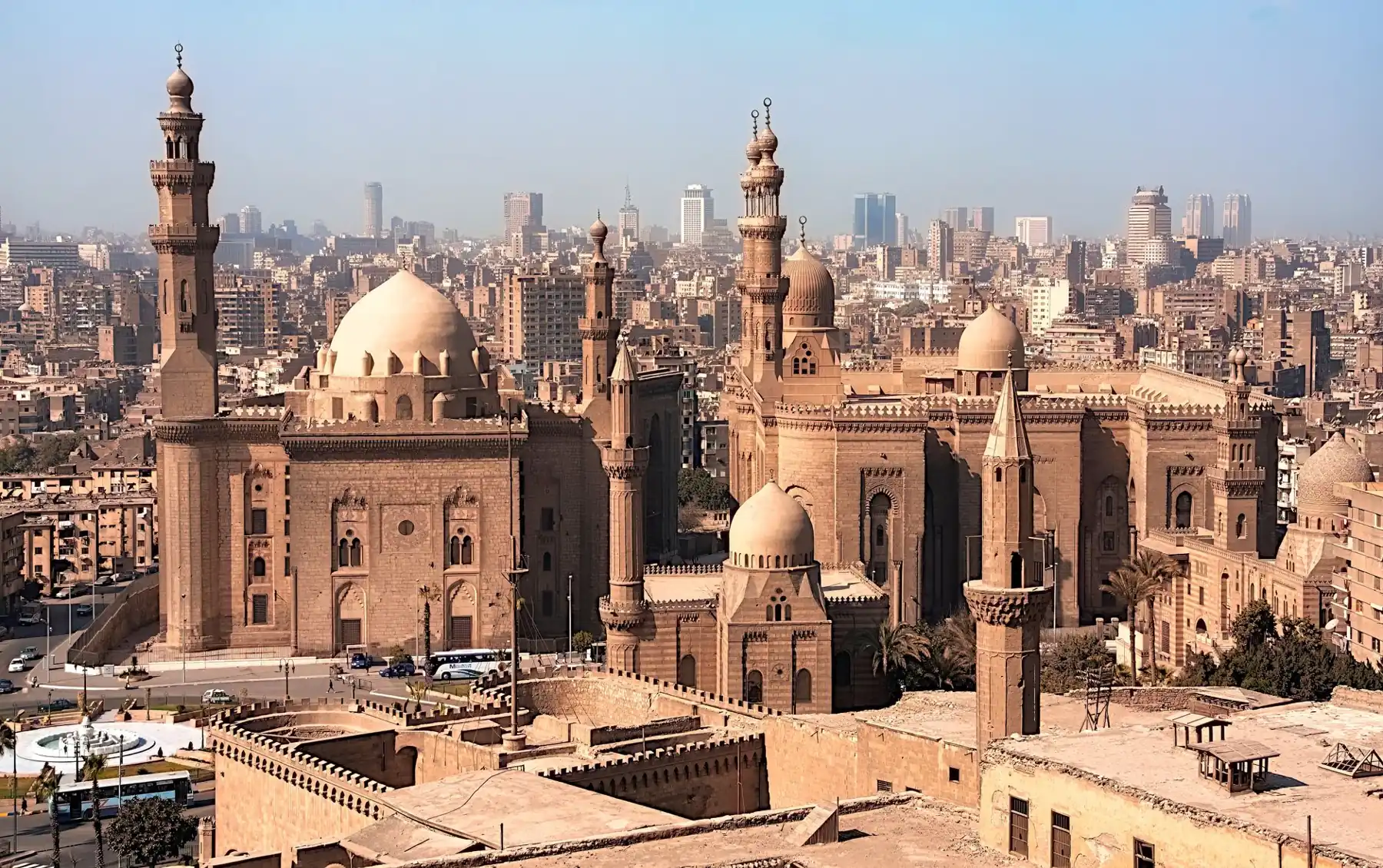 Sultan Hasan and Al-Rifa’i mosques below Cairo’s Citadel, with the city skyline beyond