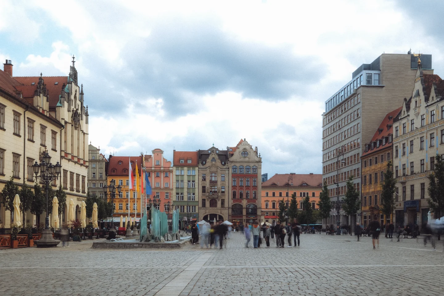 Historic buildings and the glass fountain on Wrocław Market Square